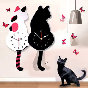 Wall clock in the shape of a cat wagging its tail