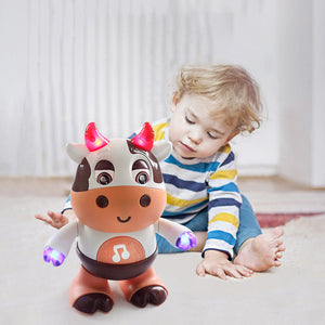 A musical toy in the shape of a cow for a baby